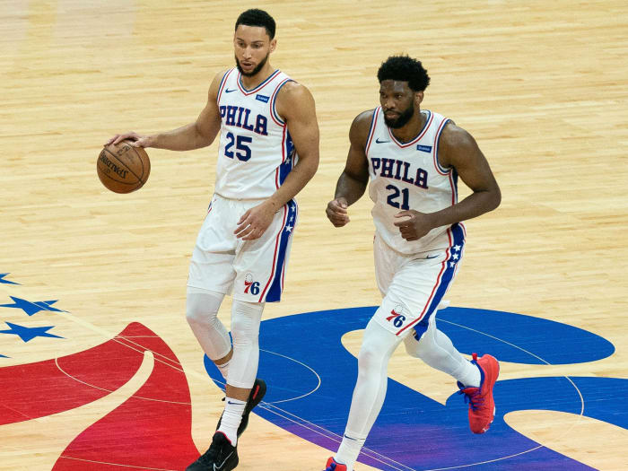 Philadelphia 76ers guard Ben Simmons (25) and center Joel Embiid (21) bring the ball up court against the Atlanta Hawks during the second quarter of game seven